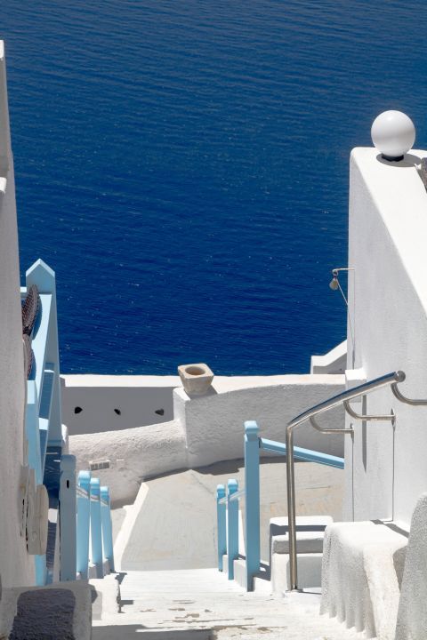 Fira: Whitewashed buildings with blue-colored details are found everywhere around Fira
