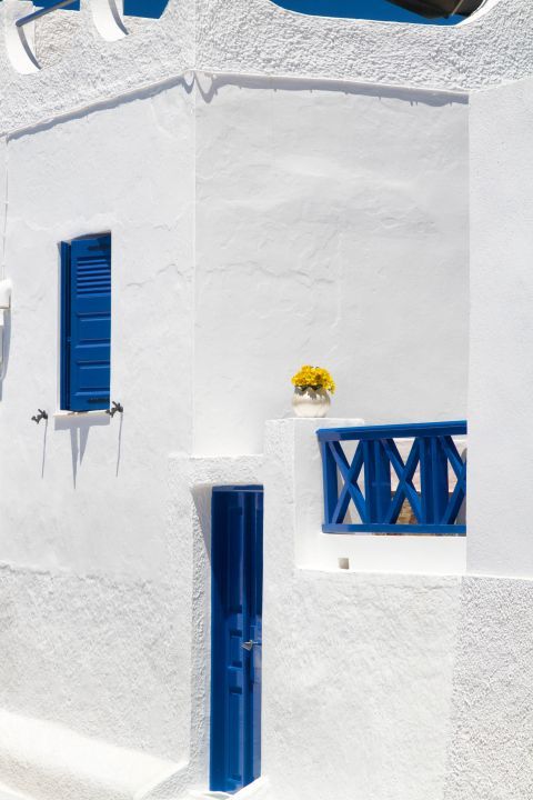 Fira: Blue door and windows on a whitewashed building