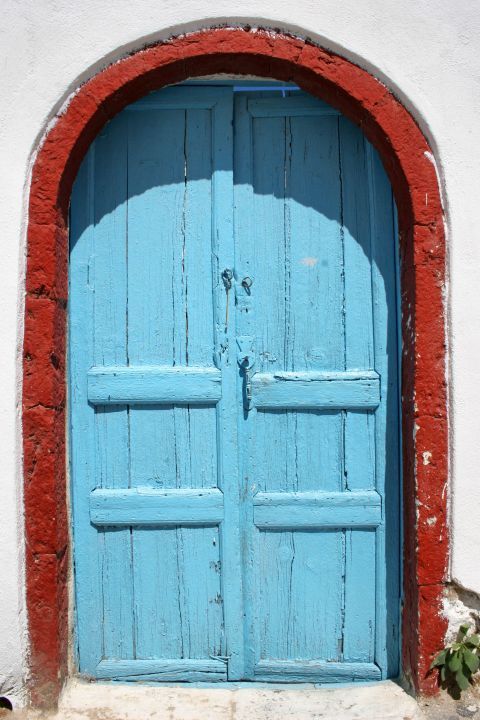 Oia: A blue-colored door