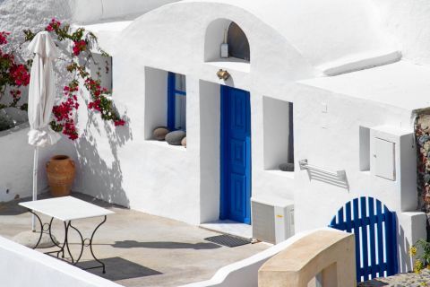 Oia: A white house with blue-colored details