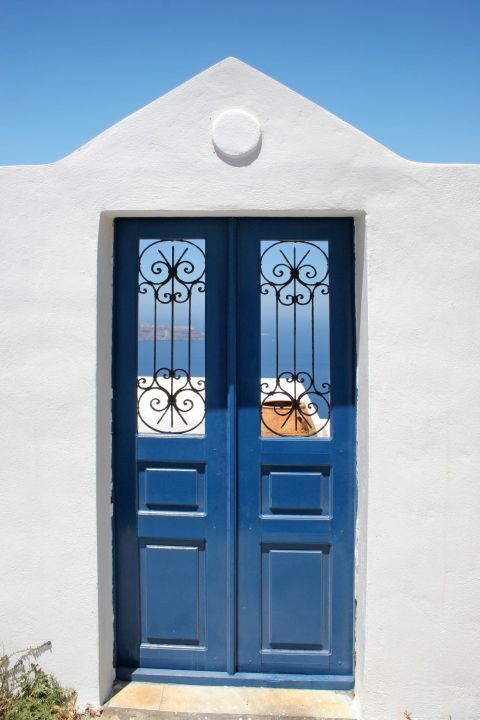 Imerovigli: A blue-colored door