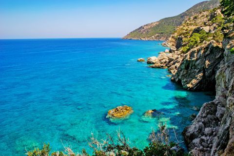 Kyra Panagia: Turquoise waters and rock formations.
