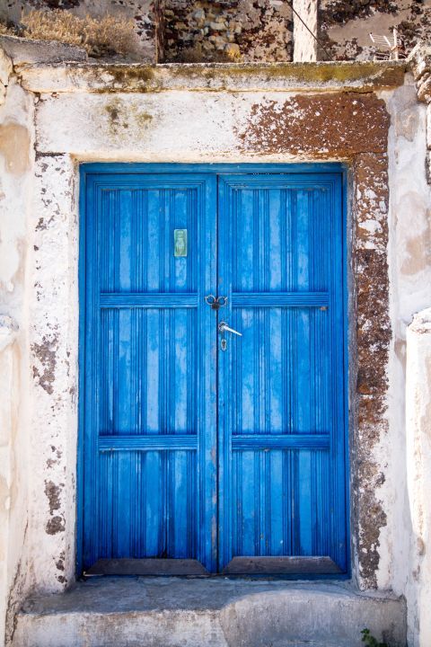 Akrotiri: A blue-colored door