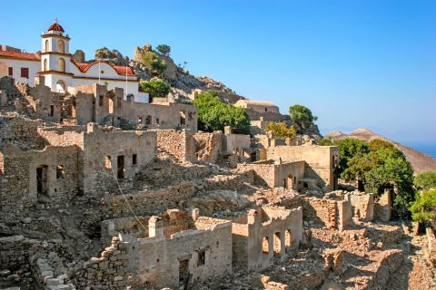Mikro Chorio: The only thing that has survived is the beautiful whitewashed church, which is surrounded by ruins.