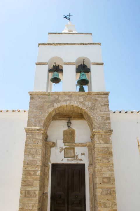 Chora: A beautiful belfry with stone built details.