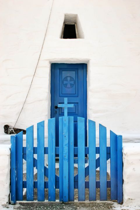 Drios: A whitewashed chapel with blue colored details