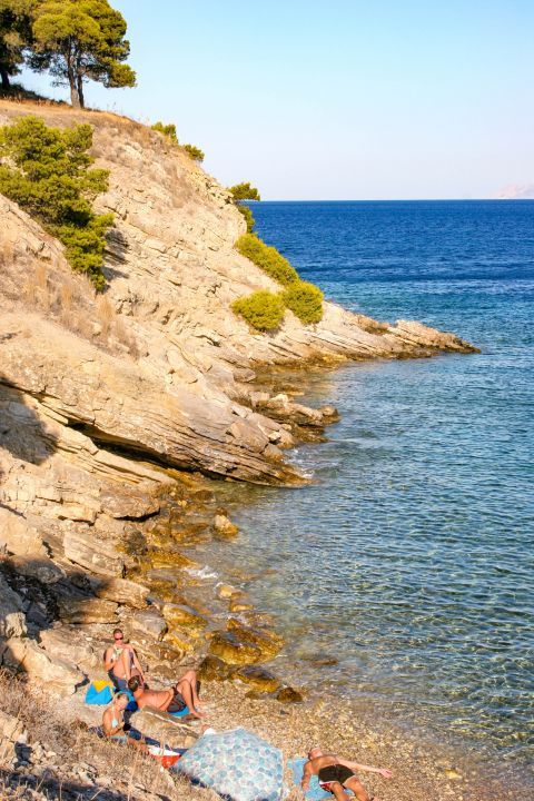 Town beach: The shore is rocky on the left side, but this does not prevent locals and visitors from enjoying its crystal clear blue waters.