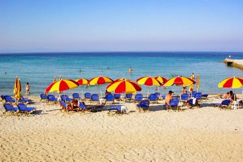 Kalithea: Umbrellas and sun loungers on Kallithea beach.