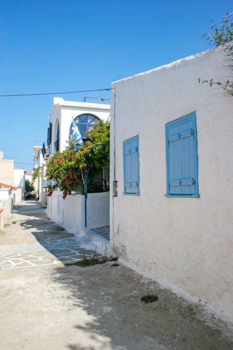 Perdika: Whitewashed buildings with blue-colored shutters.
