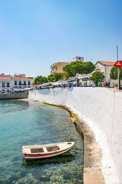 Town: A small fishing boat on the crystal clear waters of Spetses.