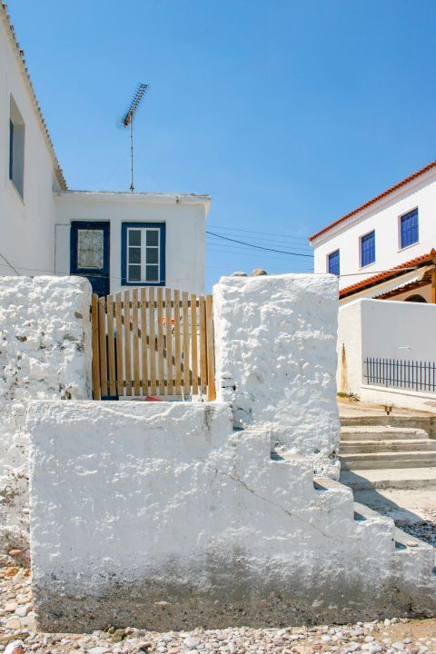 Town: A whitewashed house with blue-colored details.