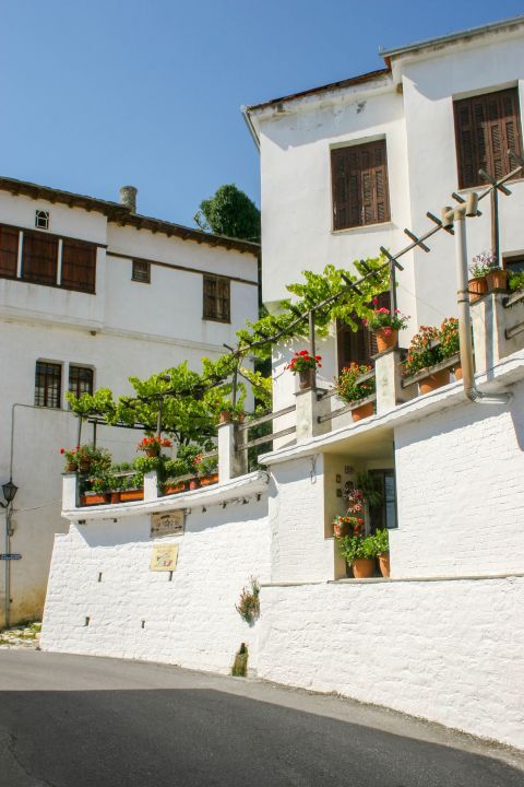 Millies: Spacious, whitewashed buildings with wooden shutters.