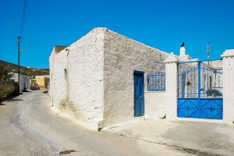 Kattavia: A whitewashed house with blue colored details.