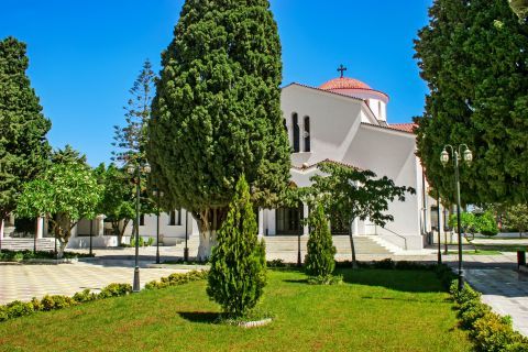 Kremasti Village: Green spots and beautiful trees on the yard of Virgin Mary Kremasti church.