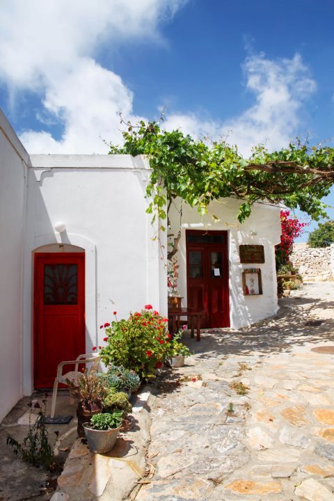 Vroutsis: Whitewashed houses with red colored doors