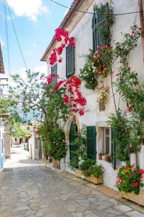 Liapades Village: An old house with beautiful flowers and colorful shutters