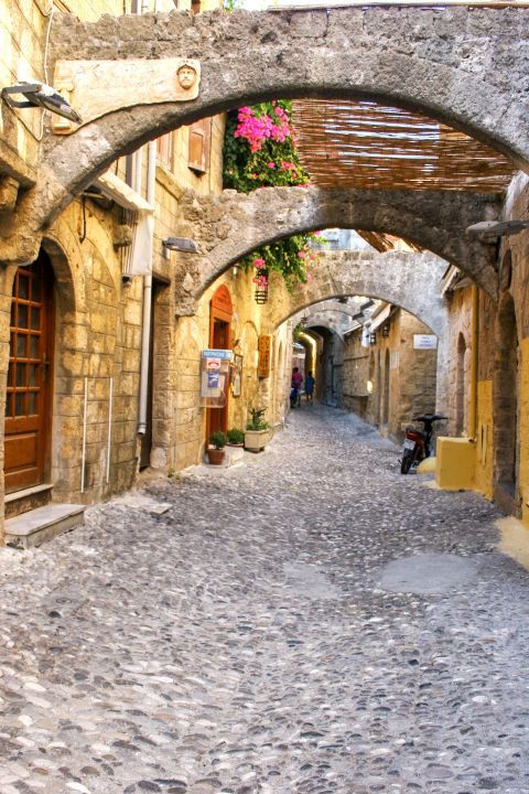 Town: Paved path with stone built arches
