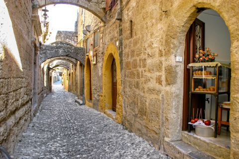 Town: Paved street and stone built arches.