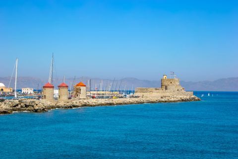 Town: Traditional, stone built windmills on the port of the Old Town of Rhodes.