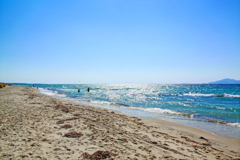 Marmari: Sandy beach with azure waters.