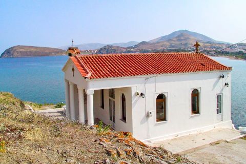 Myrina: Whitewashed chapel with ceramic roof tiles, overlooking the sea.