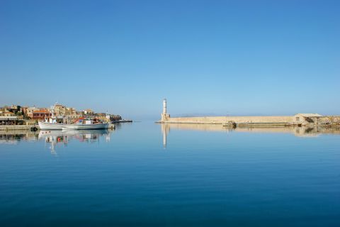 Town: Distant view of the port and the lighthouse of Chania.