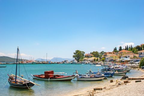 Ligia: The picturesque fishing port is filled with many boats.