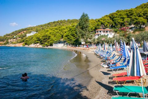 Monastiri: Some umbrellas and sun loungers are spotted on this beach.