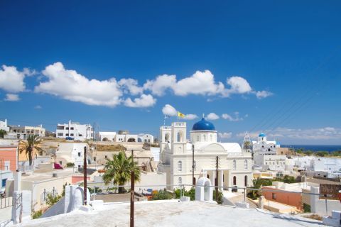 Karterados: A whitewashed church with a blue-colored dome
