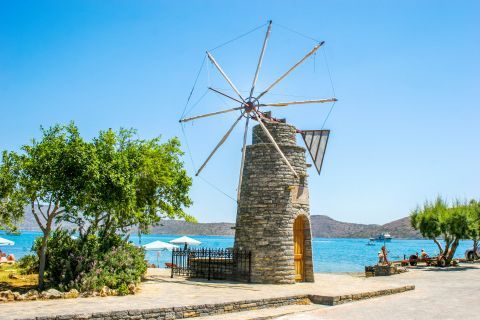 Elounda: A stone-built windmill. A landmark of Elounda village.