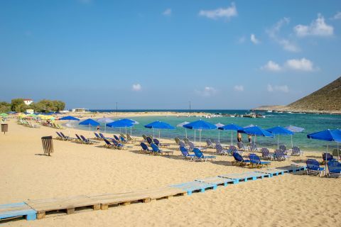 Stavros: Sun loungers and umbrellas
