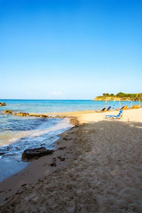 Alykanas: Some umbrellas and sun loungers are found on Alykanas beach.