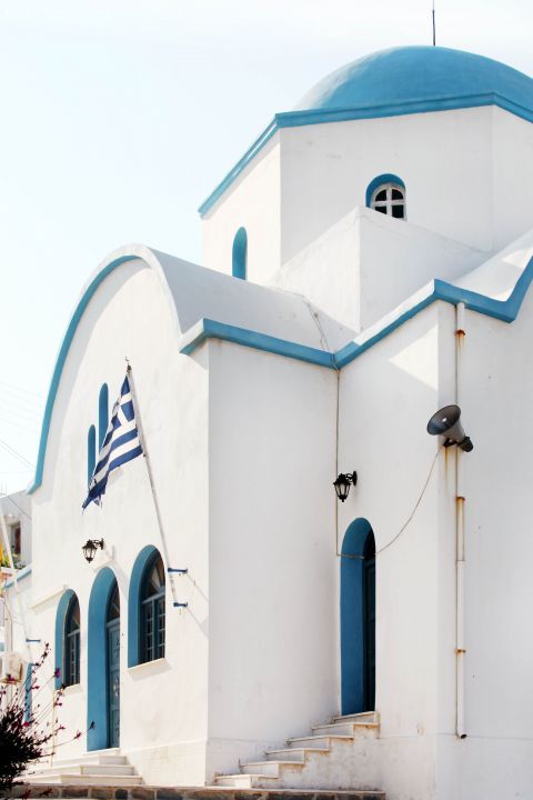 Apollonas: A Cycladic church in white and blue colors