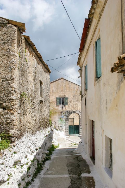 Pelekas: A street with stone built buildings