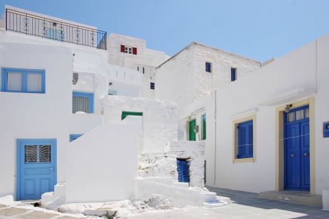 Chora: Quiet alleys, formed by whitewashed houses with blue-colored details.