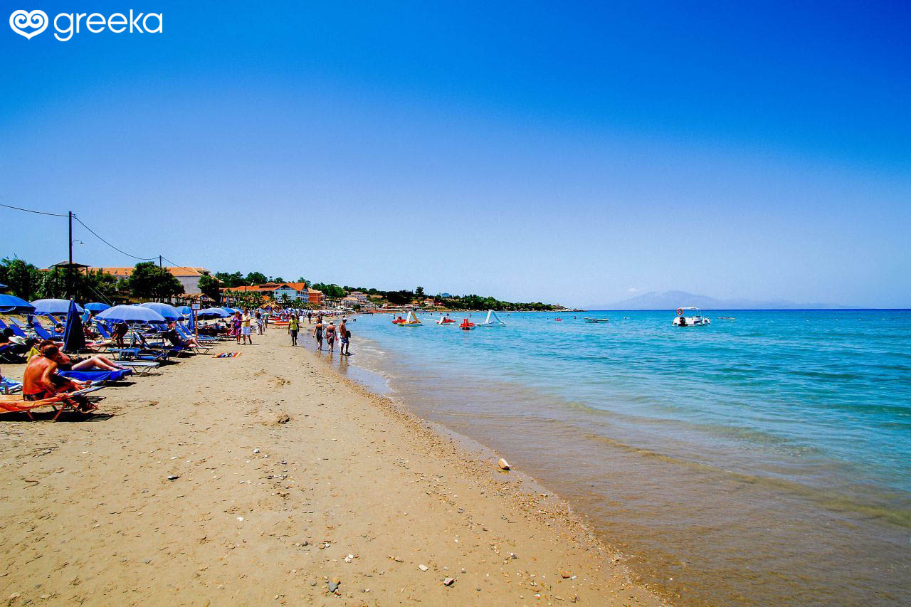 Sunbathers and watersport facilities at the organized, sandy Tsilivi Beach in Zakynthos