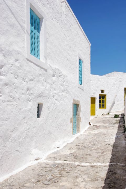 Plaka: Whitewashed houses with colorful windows