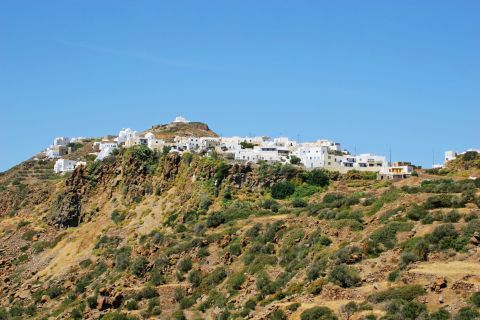 Plaka: Whitewashed buildings, constructed on top of a mountainside.