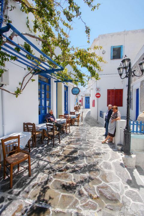 Plaka: A paved alley with lovely taverns. Plaka village, Milos.