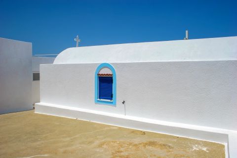 Town: A whitewashed chapel with blue colored details.