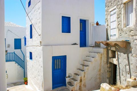 Town: Whitewashed house with blue colored details.