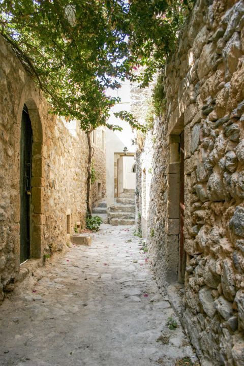 Kastro Monemvasias: A narrow alley, formed by stone built houses.