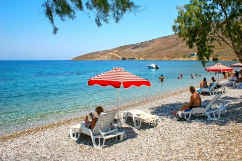 Livadia: Umbrellas and sun loungers on Livadia beach.