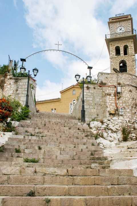 Town: Stairs, leading to an impressive church with a stone-built tower clock.