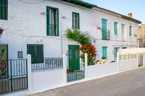 Vathy: Whitewashed houses with colorful doors and shutters.