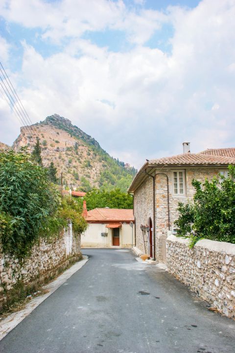 Town: Stone built houses, surrounded by a mountainous landscape.