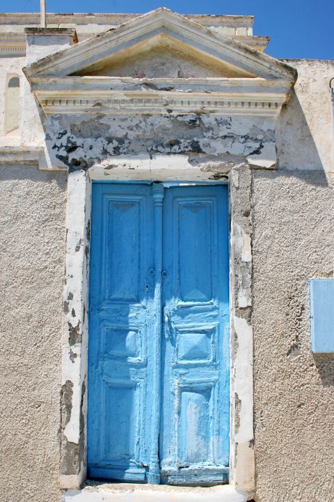 Emporio: An old Cycladic building with a blue-colored door