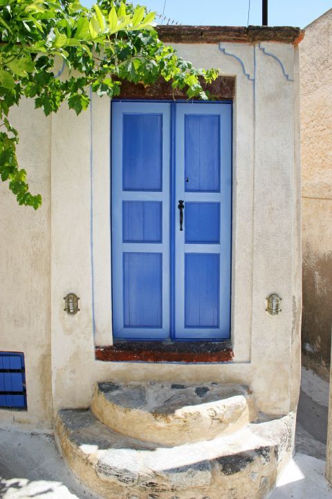 Emporio: A blue-colored door