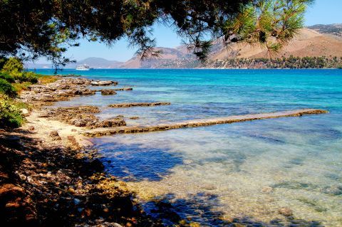 Argostoli: A tranquil beach with clear waters.