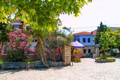 Afitos: A colorful place with flowers and trees.